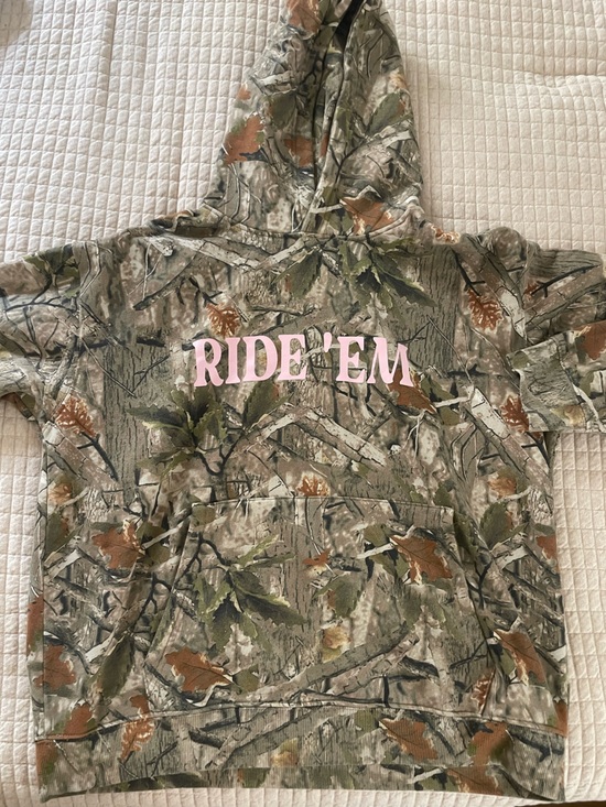 Urban Outfitters Tops - Women’s  Camo Hoodie with Pink "RIDE EM" Graphic